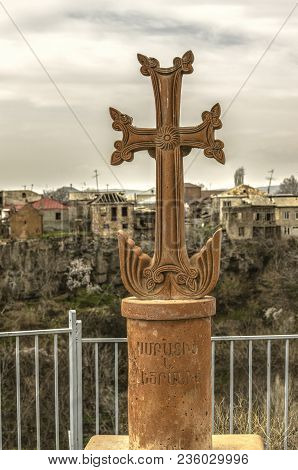 Ashtarak,armenia,19 Februar,2018: Stone Cross On A Cylindrical Pedestal In Front Of The St. Sarkis C