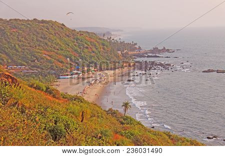 People On The Beach. View From The Top Of The Beach Vagator, India, Goa. Bay Of The Lagoon Beach Is 