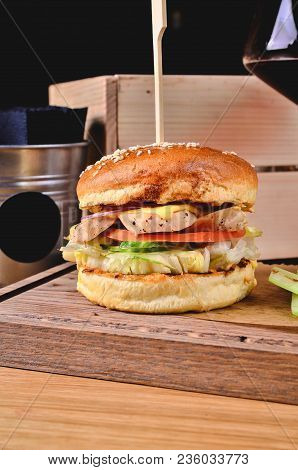 Top View Fresh Homemade Burger With Chicken, Salad, Cheese, Onion, Cucumber, Tomato, Sause And Dark 