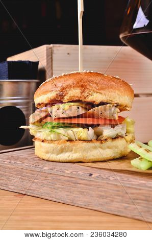 Top View Fresh Homemade Burger With Chicken, Salad, Cheese, Onion, Cucumber, Tomato, Sause And Dark 