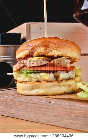 Top View Fresh Homemade Burger With Chicken, Salad, Cheese, Onion, Cucumber, Tomato, Sause And Dark 