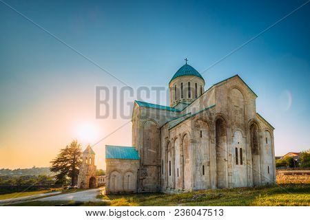 Kutaisi, Georgia. Sun In Sunset Time Above Old Walls Of Bagrati Cathedral. Unesco World Heritage Sit