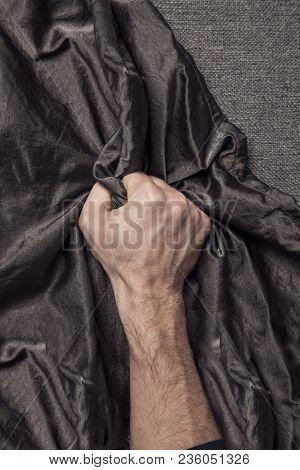 Man's Hand Holding A Satin Sheet, A Moment Of Pleasure
