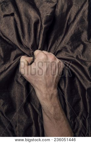Man's Hand Holding A Satin Sheet, A Moment Of Pleasure