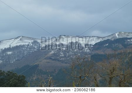 Snowy Mountains Of The Gorbeia National Park Views From Urigoiti. Nature Mountains Landscapes. March
