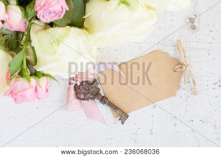 Pink And White Blooming Roses With Sceleton Key, Copy Space On Paper Note