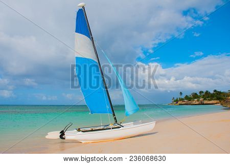 Holguin, Guardalavaca Beach, Cuba: Sailing Boat Stands On The Beach