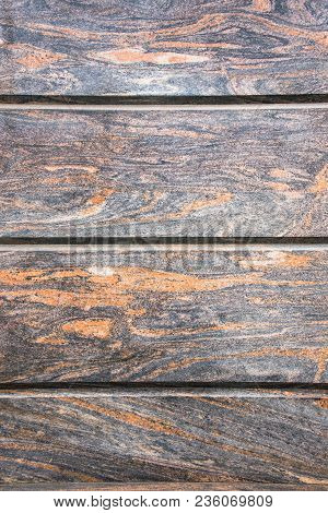 Decorative Facing, Made Of A Gray Polished Stone Plates With A Natural Fancy Ornament Like A Randoml