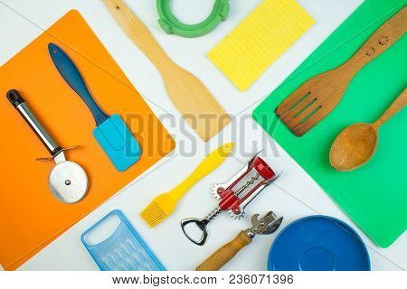 Background Of Kitchen Utensils On White Wooden Kitchen Table. Tools. Top View