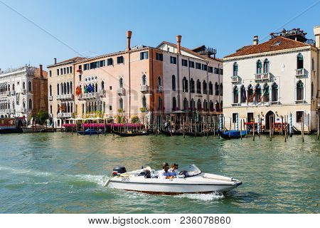 Venice, Italy - June, 21, 2013: Motorboat On Grand Canal. Foscari Palace, Palazzo Barbaro On The Bac