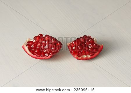 Big Ripe Red Granets Or Garnets. Fruits Of Red Ripe Pomegranate On The White Background. Vegetarian 