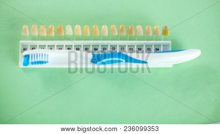 Dental Model And Dental Equipment On Blue Background, Concept Image Of Dental Background. Dental Hyg