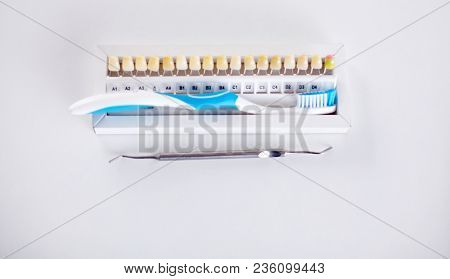 Dental Model And Dental Equipment On Blue Background, Concept Image Of Dental Background. Dental Hyg