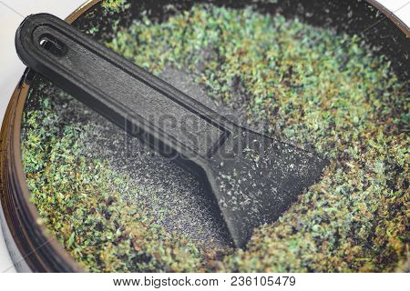 Kief In Grinder For Weed Trichomes Buds Of Cannabis Macro Top View