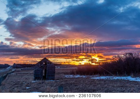 Stunning Sunrise Over A Rustic Out Building, Springbank, Alberta, Canada