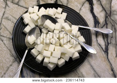 Too Much Sugar. Cubes Of Sugar In The Plate. Concept Of Unhealthy Eating