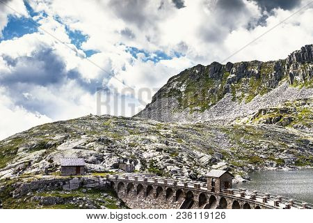 The Dam Of The Lake Of Vaca. Pass Of The Cow From Tito Secchi Refuge In Valsabbia, Brescia, Italy.