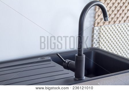 Modern Kitchen And Bathroom Water Faucets In The Store. Selective Focus. There Is Free Space For Tex