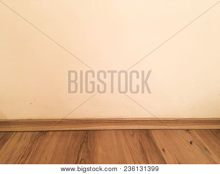 Room Wood Floor Perspective, Grunge Pastel Painted Concrete Wall And Varnished Wooden Laminate Plank