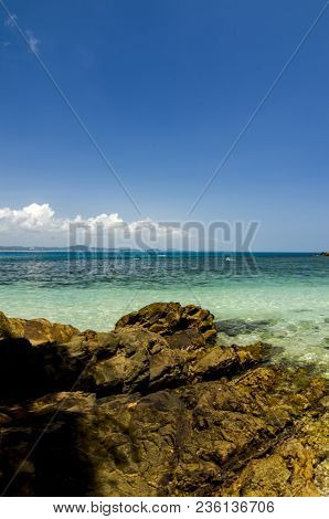 Hidden Beauty Of Kapas Island Located In Terenganu, Malaysia At Sunny Day. Blue Sky And Clear Sea Wa
