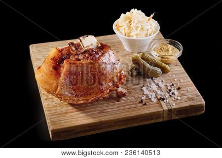 Roasted Pork Knuckle Eisbein With Braised Boiled Cabbage And Mustard On Wooden Cutting Board, On A B