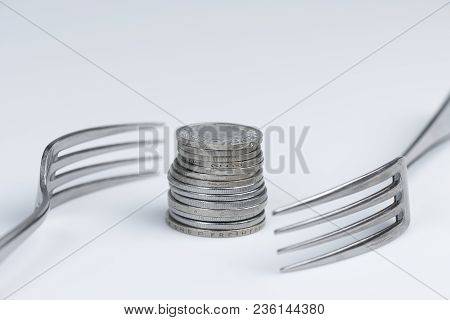 Conceptual Representation Of Financial Greed By Two Forks And Coins