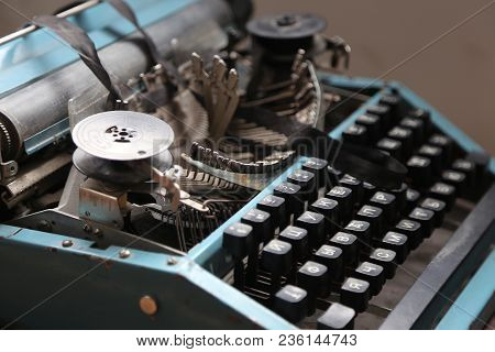 The Old Typewriter In Beams Of The Sun. In Natural Lighting, In Light From A Window. Retro Style. Ol