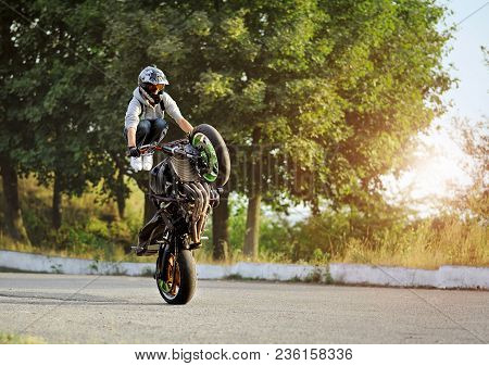 Ivano-frankivsk, Ukraine - 28 August 2015 : Biker Is Practising Doing Motorcycle Tricks Riding On On
