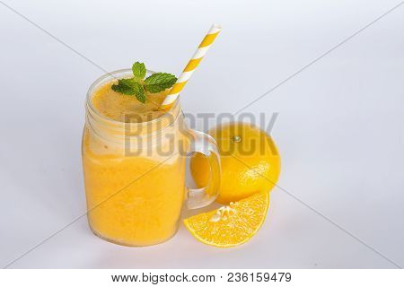 Orange Smoothies Fruit Juices And Orange Fruits. Drink On A Healthy Summer Vacation On Whitewood Bac