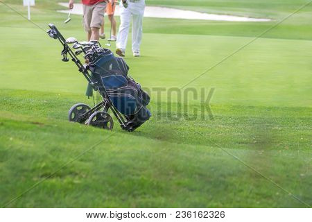 Golf Blue Bag And Trundler On Golf Course