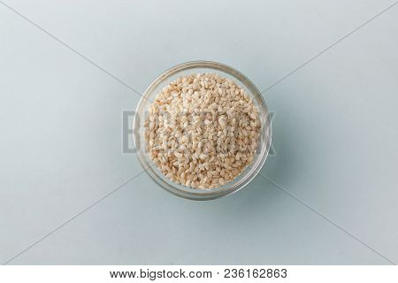 White Sesame On Wooden Background, Top View Photo