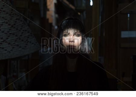 Portrait Of A Young Beautiful Woman In Arabic Style With A Decoration On Her Head.