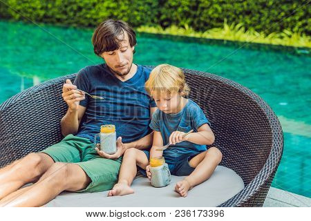 Father And Son Eat Dessert With Chia Seeds And Mangoes By The Pool In The Morning. Healthy Eating, V