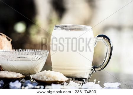 Close Up Of Famous Regional Drink Of India Apong Shrabat Or Tender Coconut Shrabat On Wooden Surface