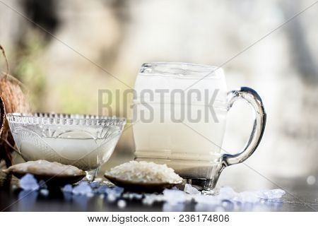 Close Up Of Famous Regional Drink Of India Apong Shrabat Or Tender Coconut Shrabat On Wooden Surface