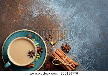 Indian Masala Chai Tea. Spiced Tea With Milk On Dark Rusty Background. Top View, Flat Lay, Copy Spac