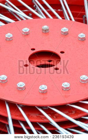 New Red Tedder For Trailer In Agricultural Machinery For Gathering Hay. Close Up