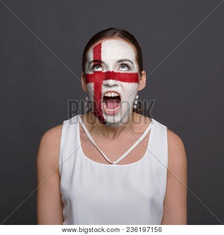Portrait Of Angry Woman With The Flag Of England Painted On His Face. Football Or Soccer Team Fan, S
