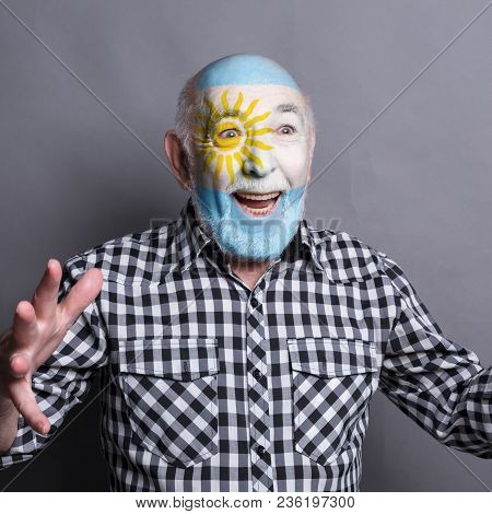 Portrait Of Happy Man With The Flag Of Argentina Painted On His Face. Football Or Soccer Team Fan, S