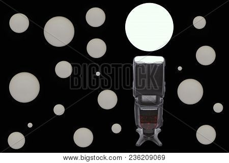 Black Photographic Speedlight On Black Background With White Circles