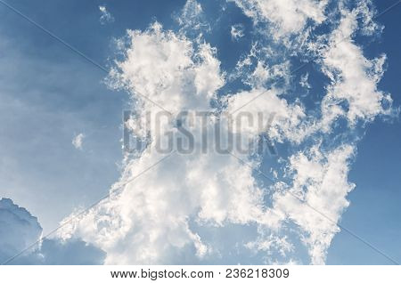 Sun Light Backlighting Behiind Large White Puffy Clouds In Vietnam In Southeast Asia.