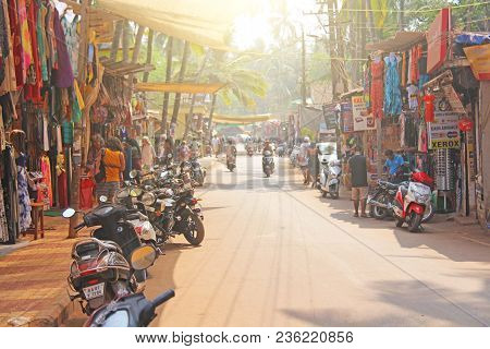 India, Goa, Arambol. January 28, 2018. The Central Street Of Arambol, On Which People Go On Scooters