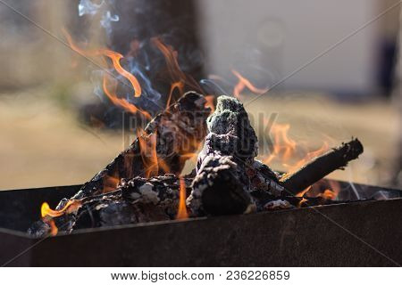 Fire In The Grill For Cooking Meat.