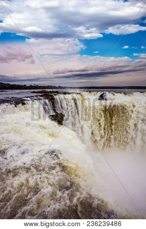 The Devil's throat /Garganta del Diablo/ in grandiose waterfalls Iguazu in the rainy season. The most full-flowing waterfall in the world. Concept of active and ecological tourism