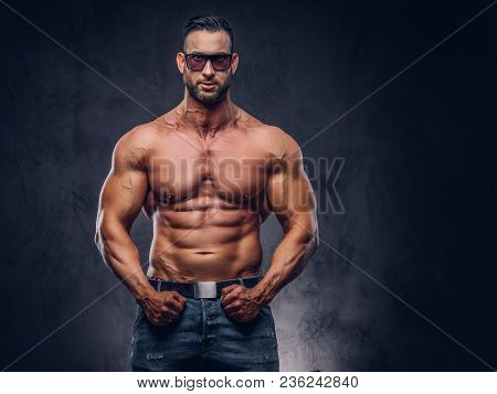 Portrait Of A Shirtless Tall Huge Male With A Muscular Body With A Stylish Haircut And Beard, In A S