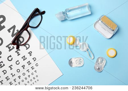 Flat Lay Composition With Contact Lenses, Glasses And Accessories On Color Background