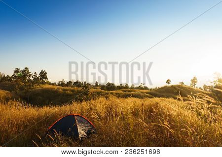 Outdoors Camping Grass Highlands Mountain In The Sunset.