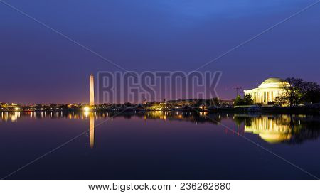 Washington Dc Panorama Around Tidal Basin At Sunrise During Cherry Blossom. City Landmarks With Refl