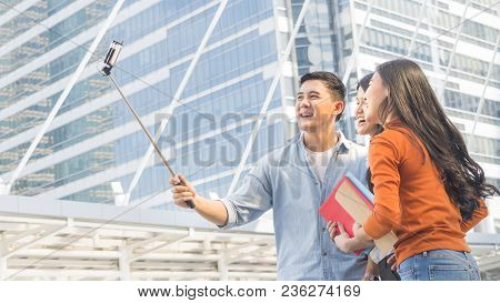 Teen Asia People Use Smart Phone To Selfie, Self-portrait Photography Shoot, Held In The Hand And Su