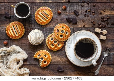 Cookies With Jam And Coffee On Rustic Wooden Table. Top View